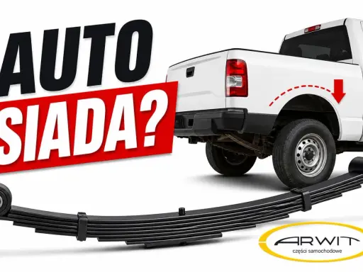 Biały pickup z napisem "AUTO SIADA?". Pod nim widać nowe resory piórowe, gotowe do montażu.